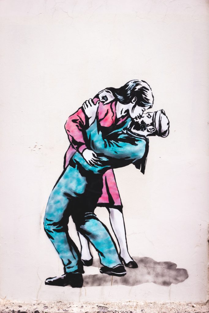 A mural of a man and woman kissing